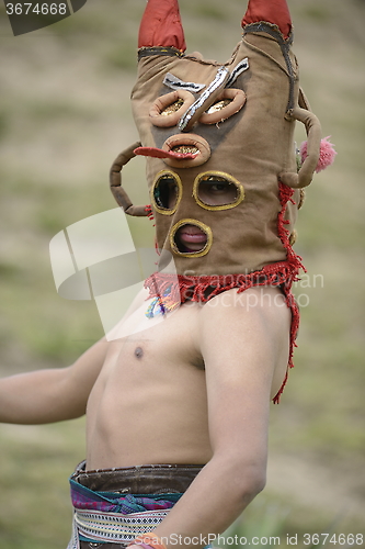 Image of Man in mask celebrating solstice holiday. 