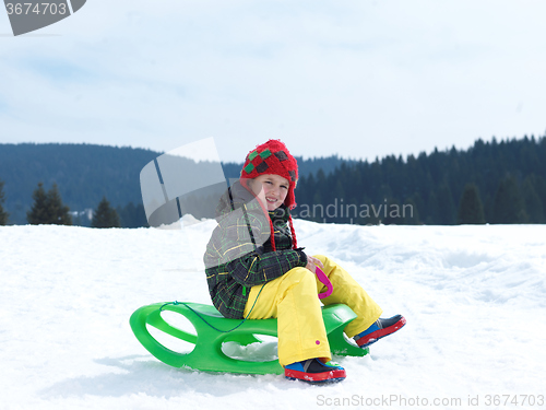 Image of happy young boy have fun on winter vacatioin on fresh snow