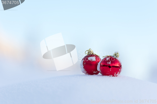 Image of red christmas balls in fresh snow