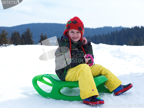 Image of happy young boy have fun on winter vacatioin on fresh snow