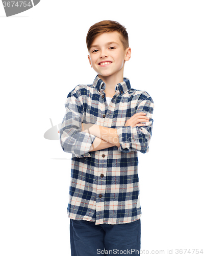 Image of smiling boy in checkered shirt and jeans