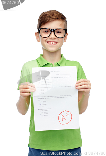 Image of happy boy in eyeglasses holding school test result