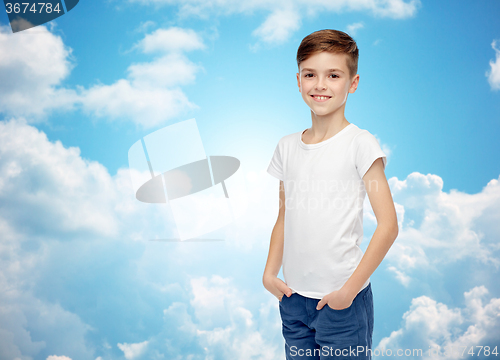 Image of happy boy in white t-shirt and jeans