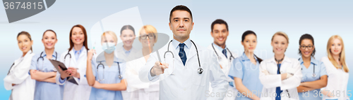 Image of group of doctors with clipboard pointing at you