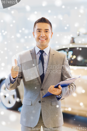 Image of happy man at auto show or car salon