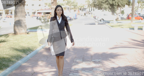 Image of Business Woman Walking In The Street