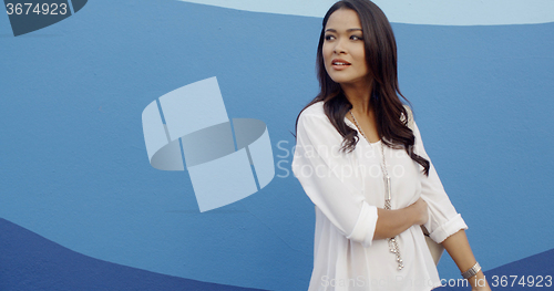Image of Glamorous Young Woman Standing At The Wall