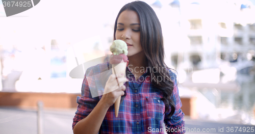 Image of Young Girl Eating Ice Cream