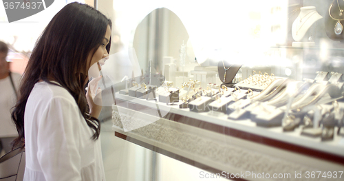Image of Woman Looking At The Shop Window