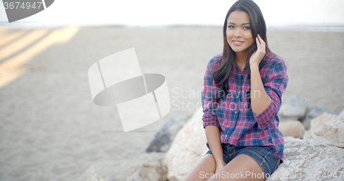 Image of Elegant Woman Posing On The Beach