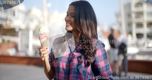 Image of Young Girl Eating Ice Cream