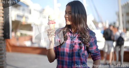 Image of Girl Eating A Delicious Ice Cream