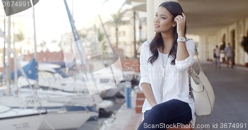 Image of Woman Relaxing On Bench In Yacht Port
