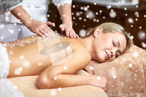 Image of close up of woman lying and having massage in spa