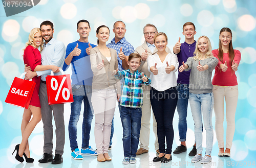 Image of group of happy people showing thumbs up