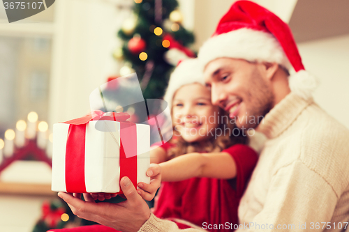 Image of close up of father and daughter with gift box