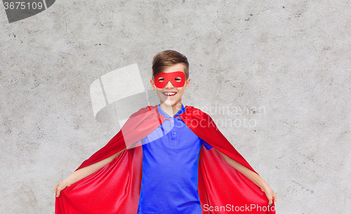 Image of boy in red super hero cape and mask