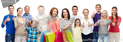 Image of happy people with shopping bags showing thumbs up