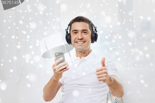 Image of happy man with smartphone and headphones