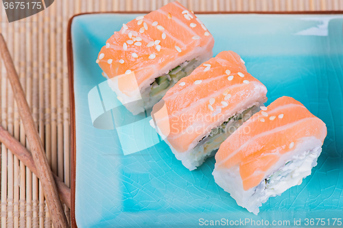 Image of Top view to california maki sushi with salmon