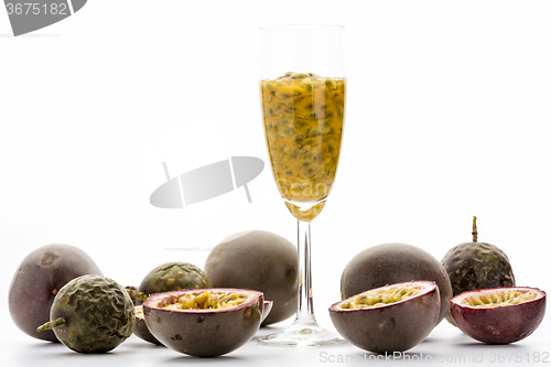 Image of Passion Fruit Pulp In A Glass Amidst Ripe Fruits
