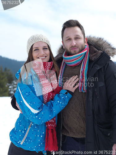 Image of romantic young couple on winter vacation