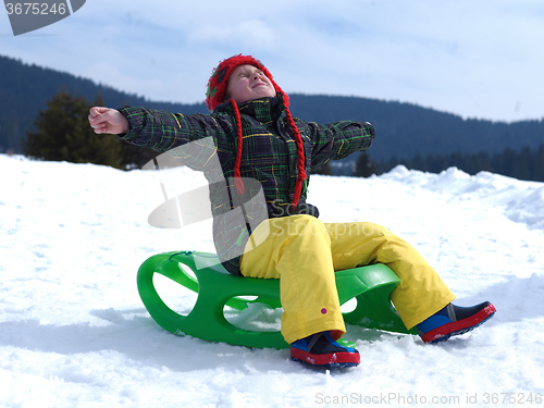 Image of happy young boy have fun on winter vacatioin on fresh snow