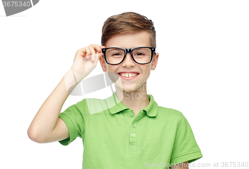 Image of happy boy in green polo t-shirt and eyeglasses
