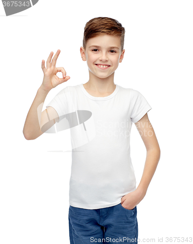 Image of happy boy in white t-shirt showing ok hand sign