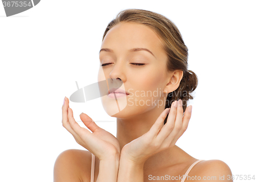 Image of young woman face and hands