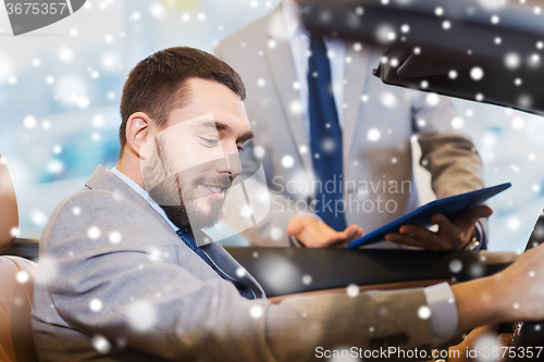 Image of happy man with car dealer in auto show or salon