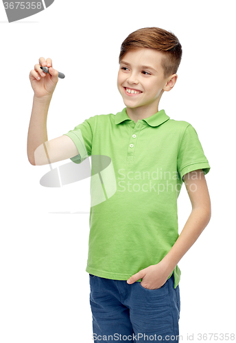 Image of happy boy in green t-shirt with marker writing