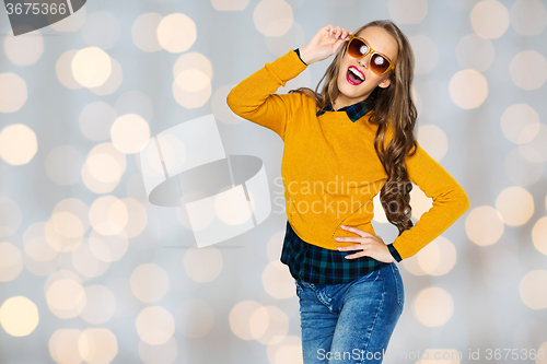 Image of happy young woman or teen girl in casual clothes