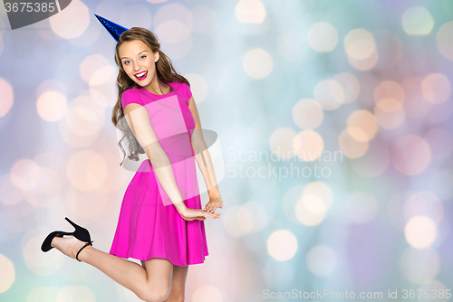 Image of happy young woman or teen girl in party cap