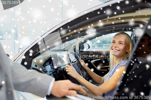 Image of happy woman with car dealer in auto show or salon