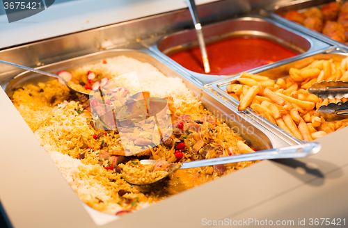 Image of close up of rice pilaf and other dishes on tray