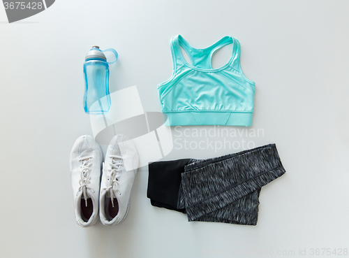 Image of close up of female sports clothing and bottle set