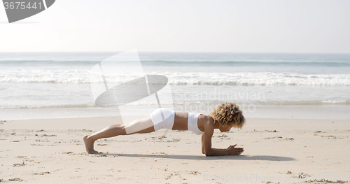 Image of Girl Working Out On The Beach