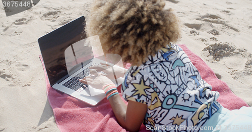 Image of Young Girl Using Computer