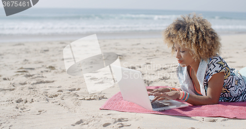 Image of Woman At The Beach Working On A Laptop