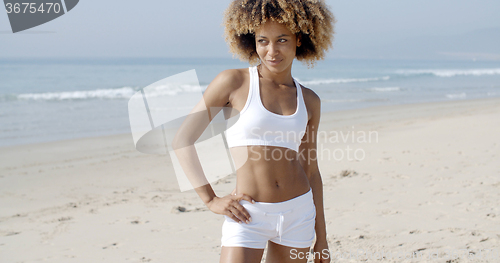 Image of Woman Walking By The Ocean Shore
