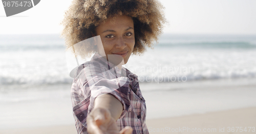 Image of Happy Woman Giving Hand On Beach