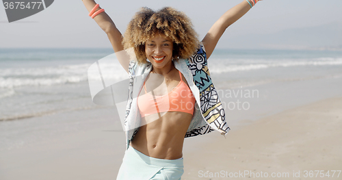 Image of Woman Joyful With Arms Up