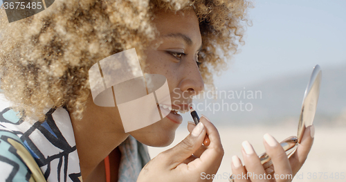 Image of Portrait Of Beautiful Woman Doing Makeup