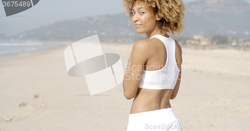 Image of Woman Walks By The Sea