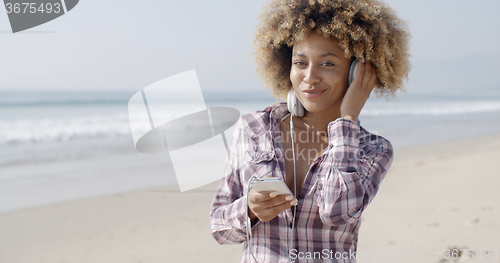 Image of African American Girl Listening To Music