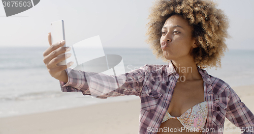 Image of Beach Young Girl Taking Selfie With Smartphone.
