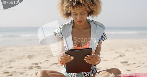 Image of Girl Using Tablet Pc At The Beach