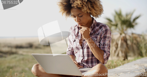 Image of Girl Working With A Laptop Outdoors