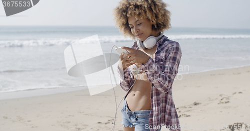 Image of Woman Texting Sms On The Beach
